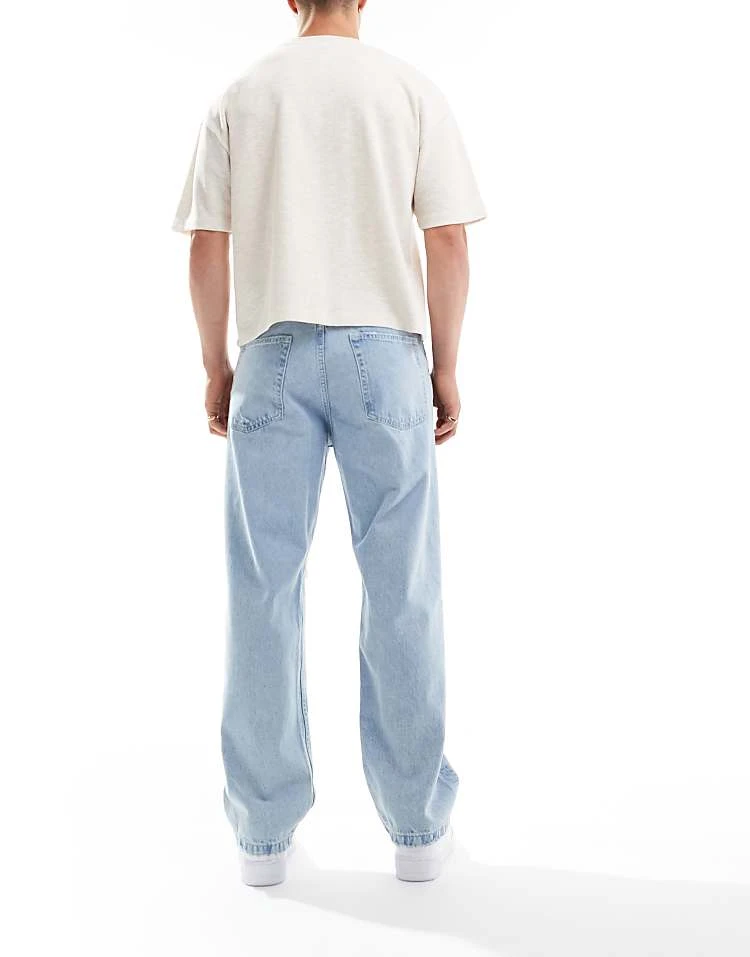 Pull&Bear Ripped Baggy Jeans In Mid Blue For Men 4 Pull&Bear Ripped Baggy Jeans In Mid Blue For Men - Image 2