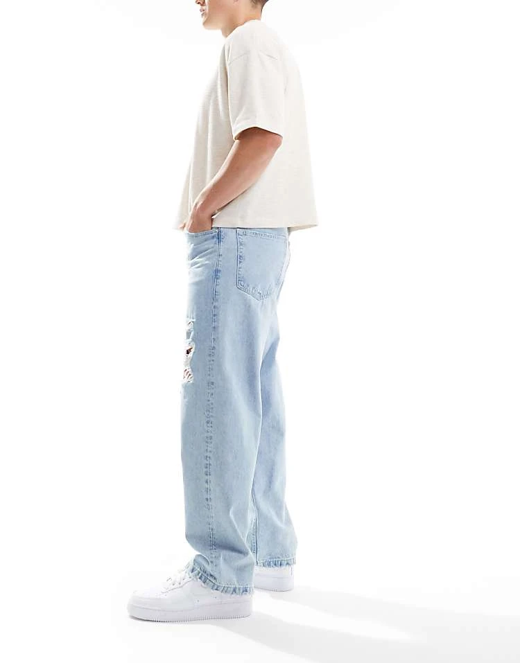 Pull&Bear Ripped Baggy Jeans In Mid Blue For Men 5 Pull&Bear Ripped Baggy Jeans In Mid Blue For Men - Image 3